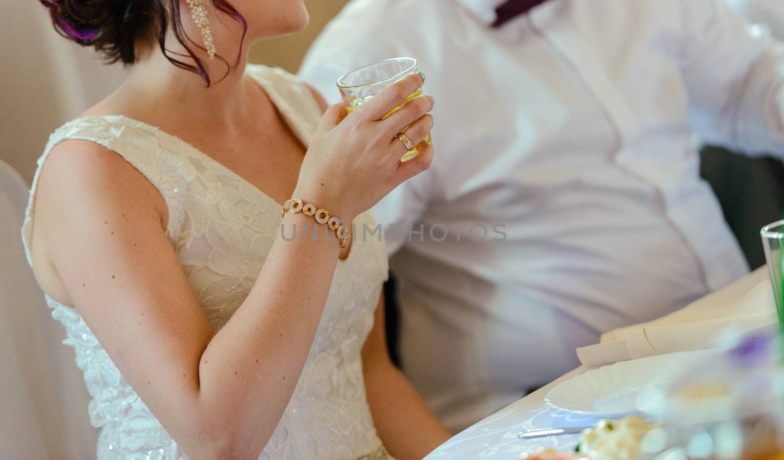 first toast of the bride and groom with a glass of champagne