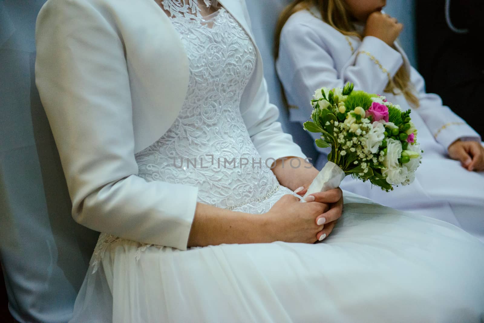 Bride and groom at church wedding during ceremony. Beautiful decoration