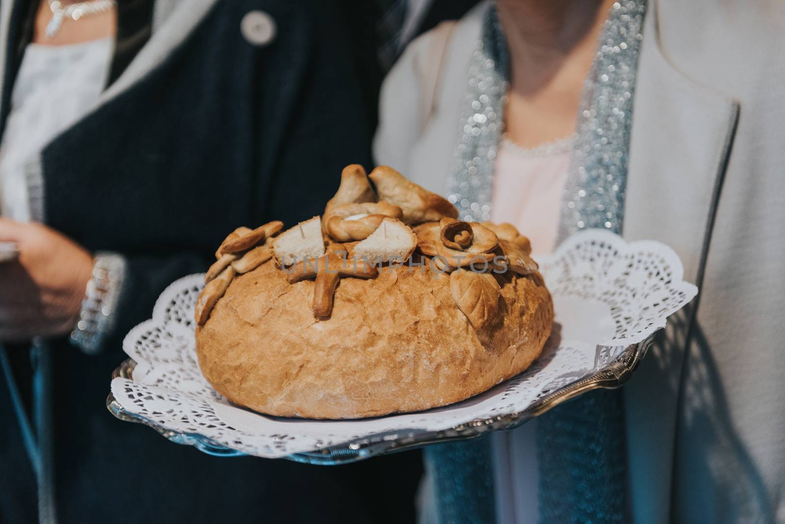 Traditional polish greeting the bride and groom by the parents with bread and salt. Vodka also in glasses.