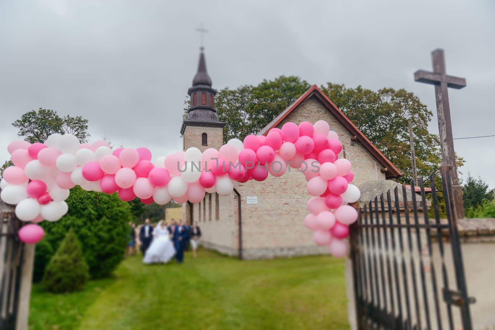 Church exterior during wedding ceremony. Blue sky with sunny weather