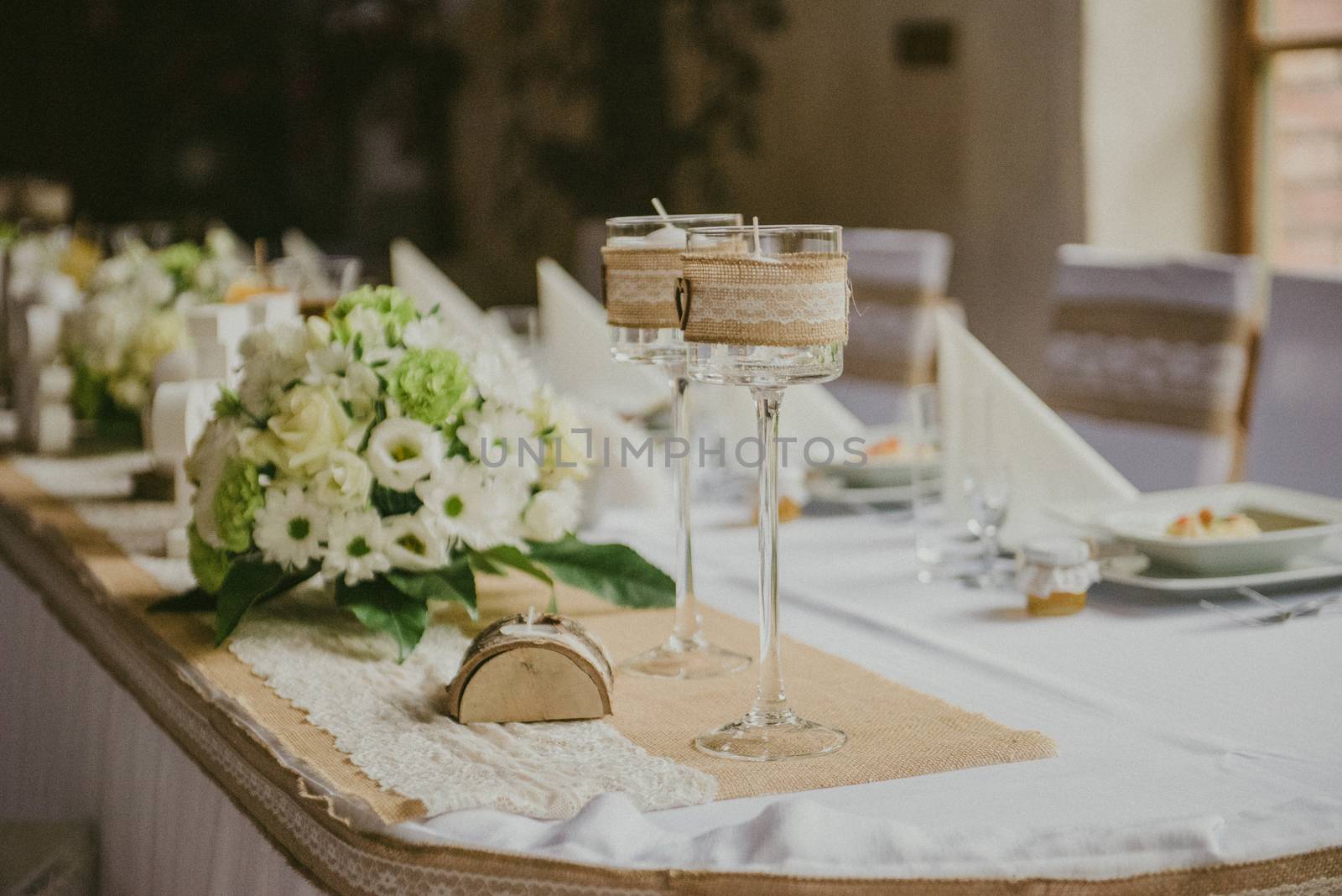 Beautifully decorated wedding table and other details at wedding hall. Wedding day