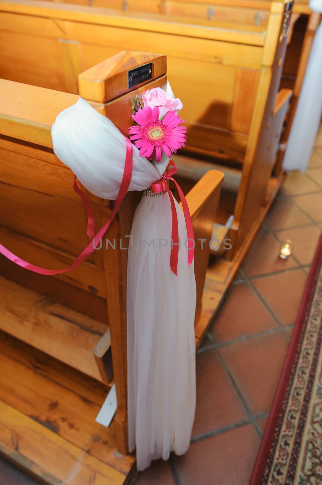 Church sanctuary before a wedding ceremony. Empty chairs for bride and groom