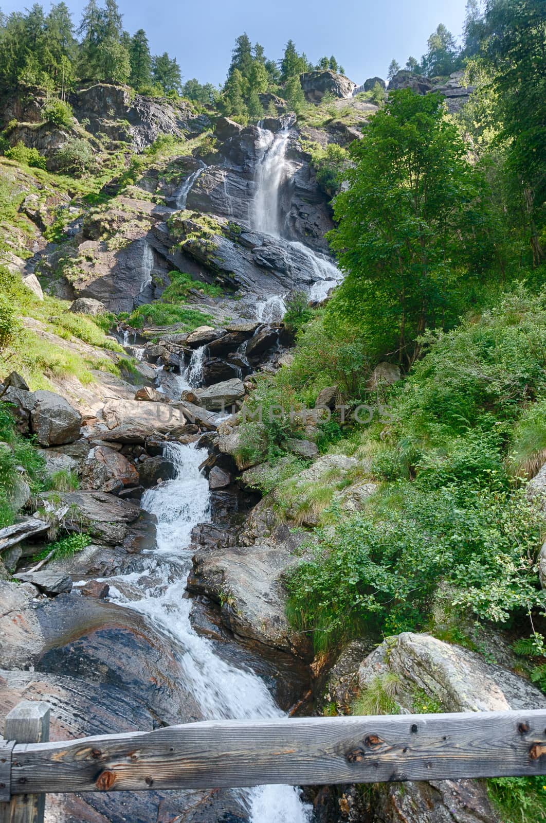 Waterfall in Italian alps travel