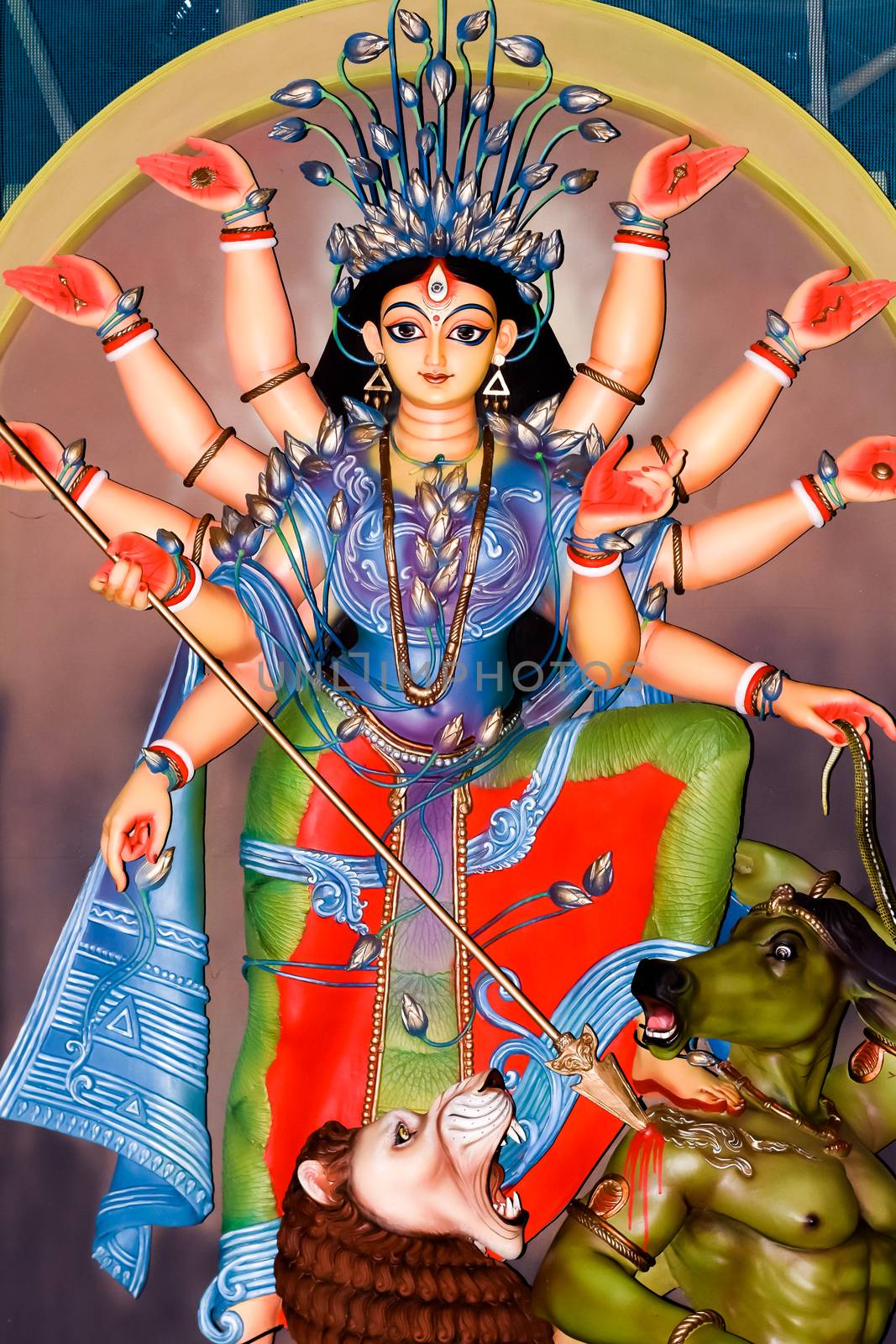 Colorful Tribal Goddess Durga idol in Rural Folk Design and theme. Worshipping the Divine Mother. Religious Handmade Sculpture. Gorgeous Hand work and perfect showcase of Indian Handicrafts. Kolkata