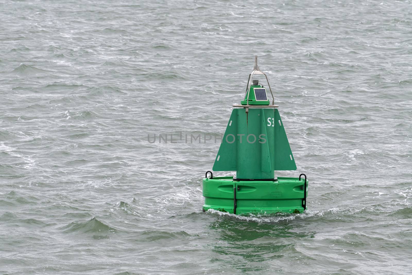 Green buoy as a marker for shipping 
 by Tofotografie