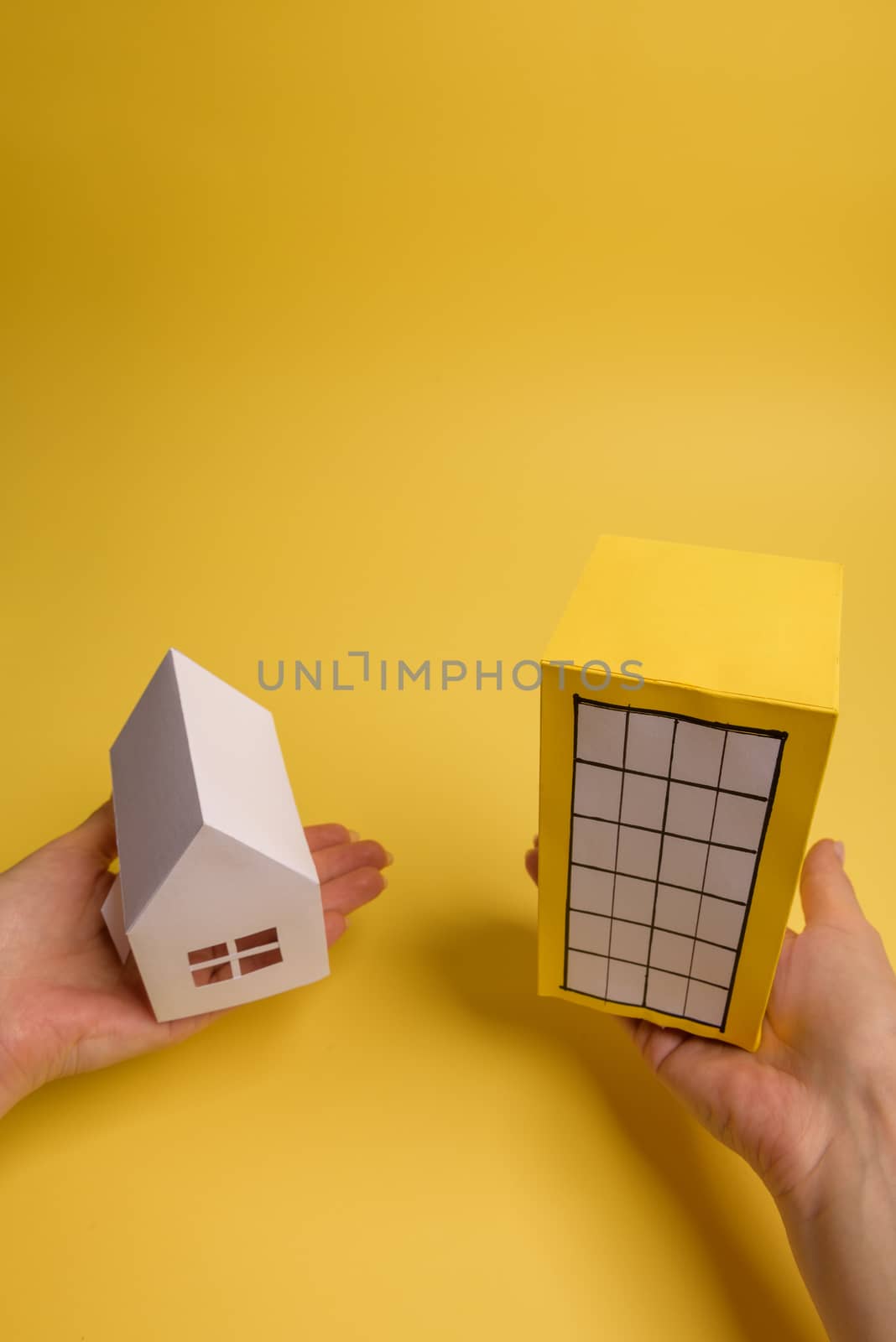 Yellow paper block of flats on yellow background paper. Minimalistic and simple concept, style. Copy space. Horizontal orientation.