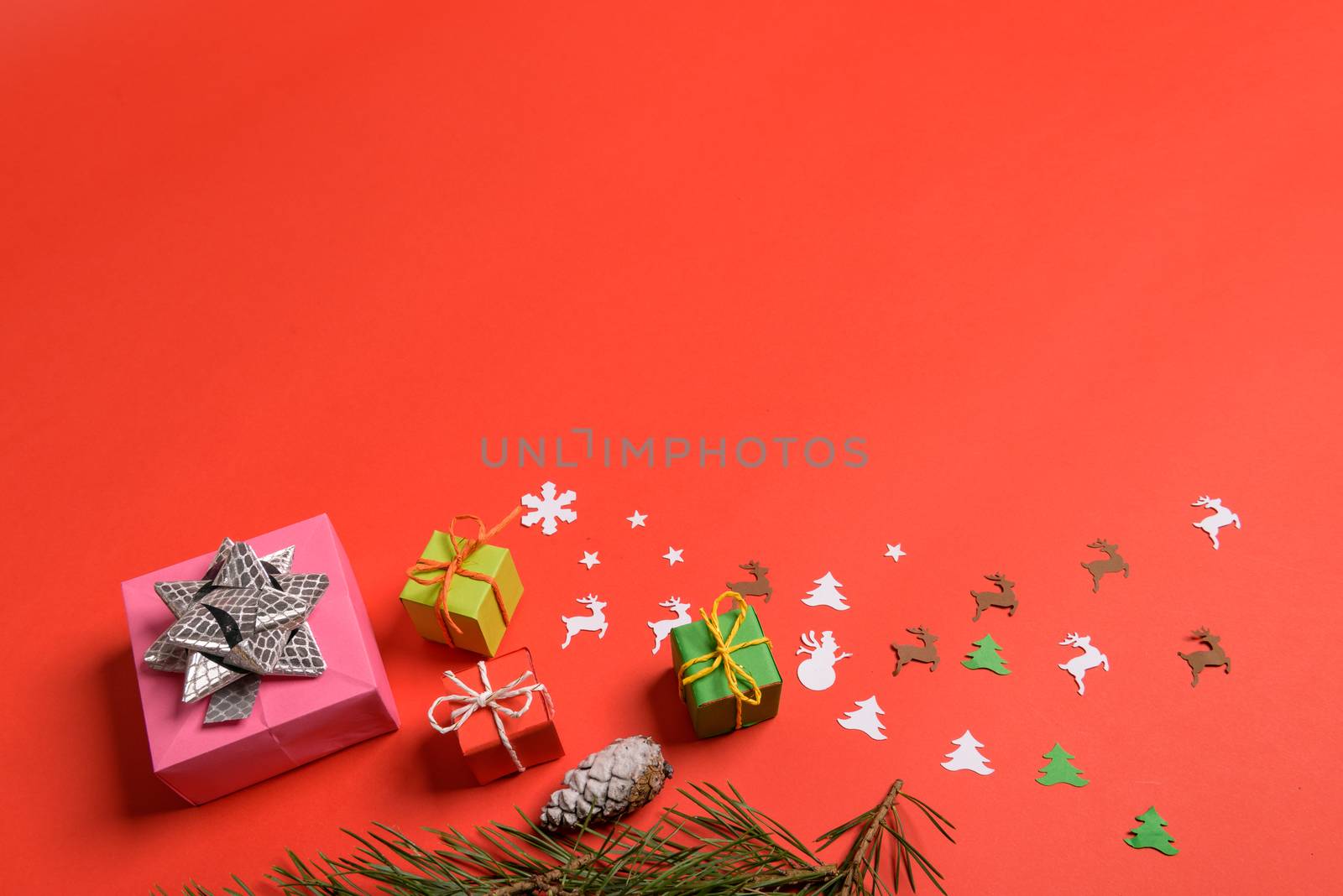 Christmas or New Year background, plain composition made of Xmas decorations and fir branches, flat lay, blank space for a greeting text.