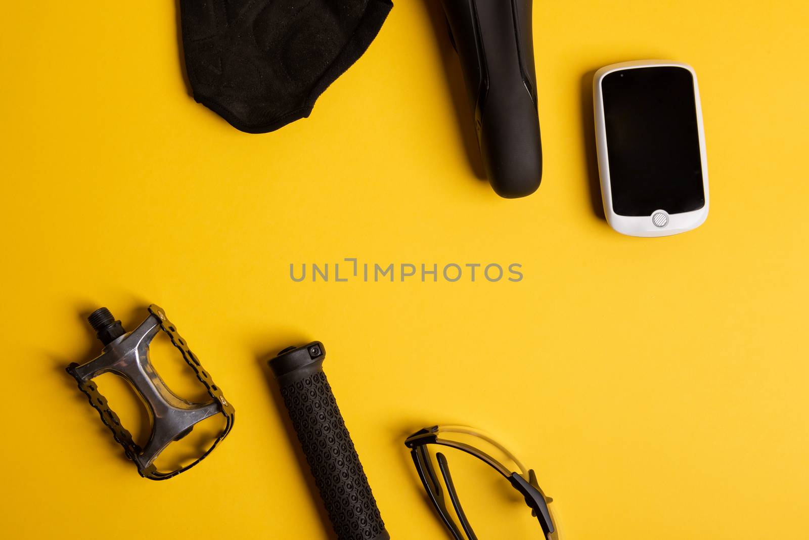 Bicycle, Cycling accessories on the yellow background. view from above
