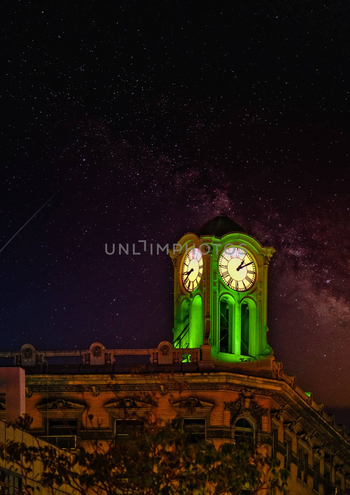 Lighted Clock Tower on Starry Night by dbvirago