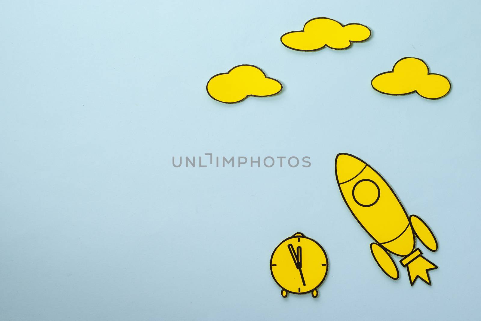 Little yellow rocket speeding through space blue sky background by sergii_gnatiuk