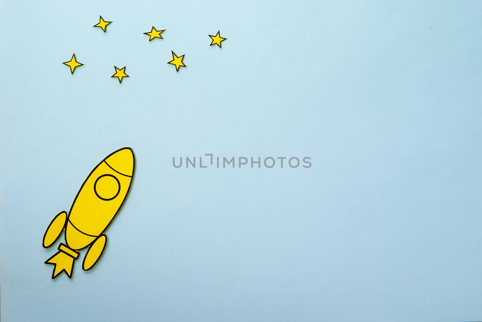 Yellow rocket with booster flames flying to stars by sergii_gnatiuk