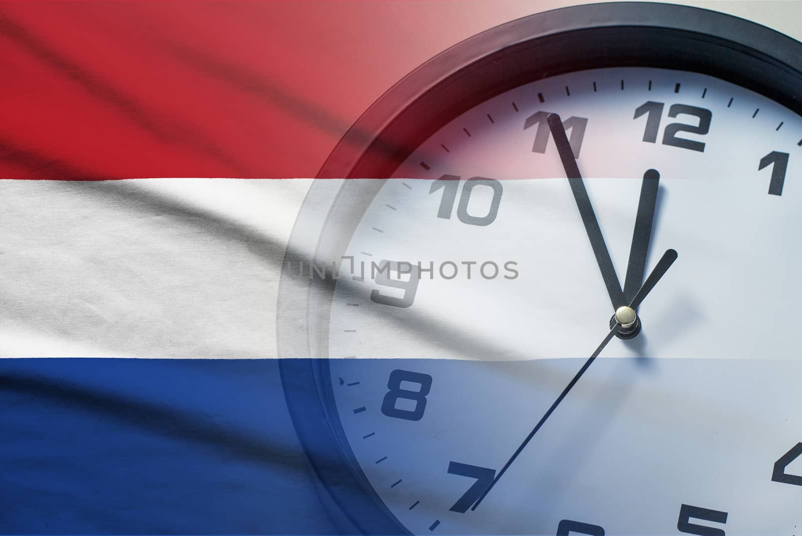 Composite of the Netherlands flag and a clock face counting down to twelve midnight or noon in a conceptual image