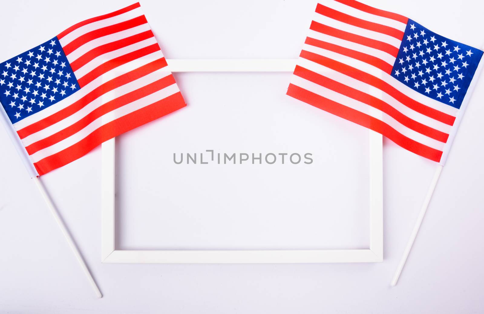 Martin luther king day, flat lay top view, American flag and photo frame on white background with copy space for your text