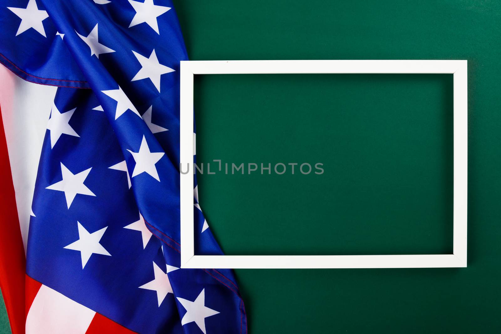 President's Day Concept, flat lay top view, America Flag and photo frame on Olive green background with copy space for your text
