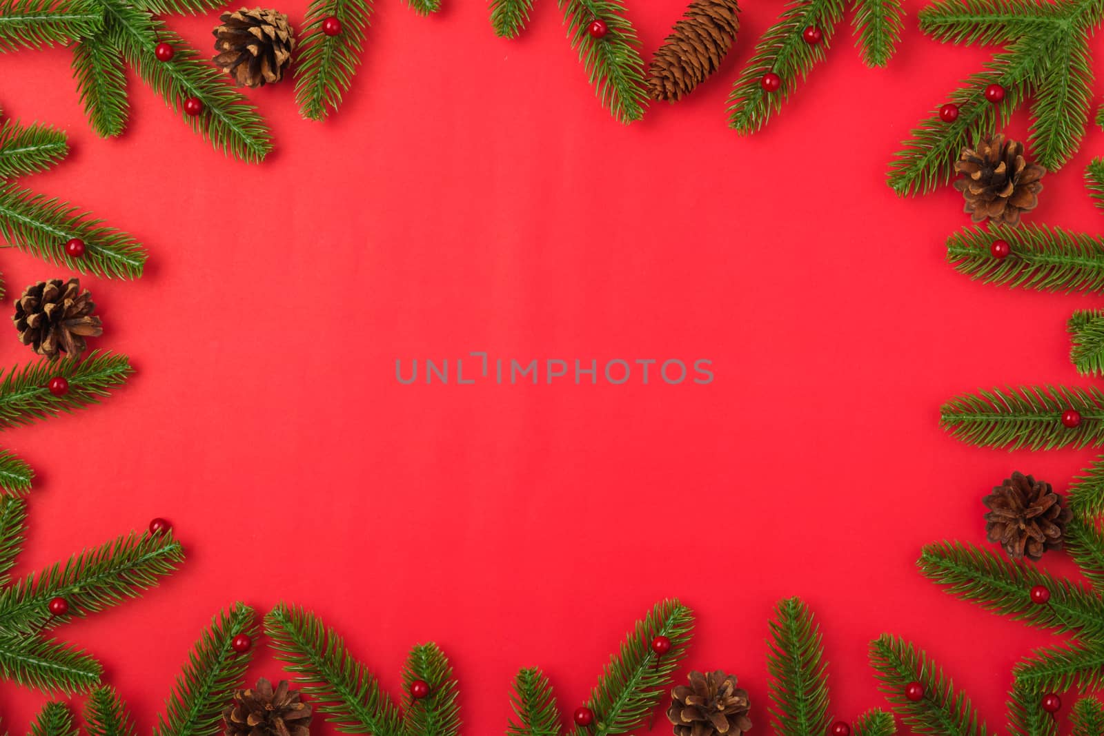 Happy new year or christmas day top view flat lay fir tree branches and decoration on red background with copy space for your text