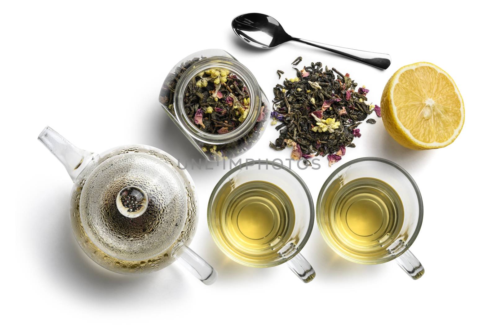 Green tea with natural aromatic additives and accessories. Top view on white background.