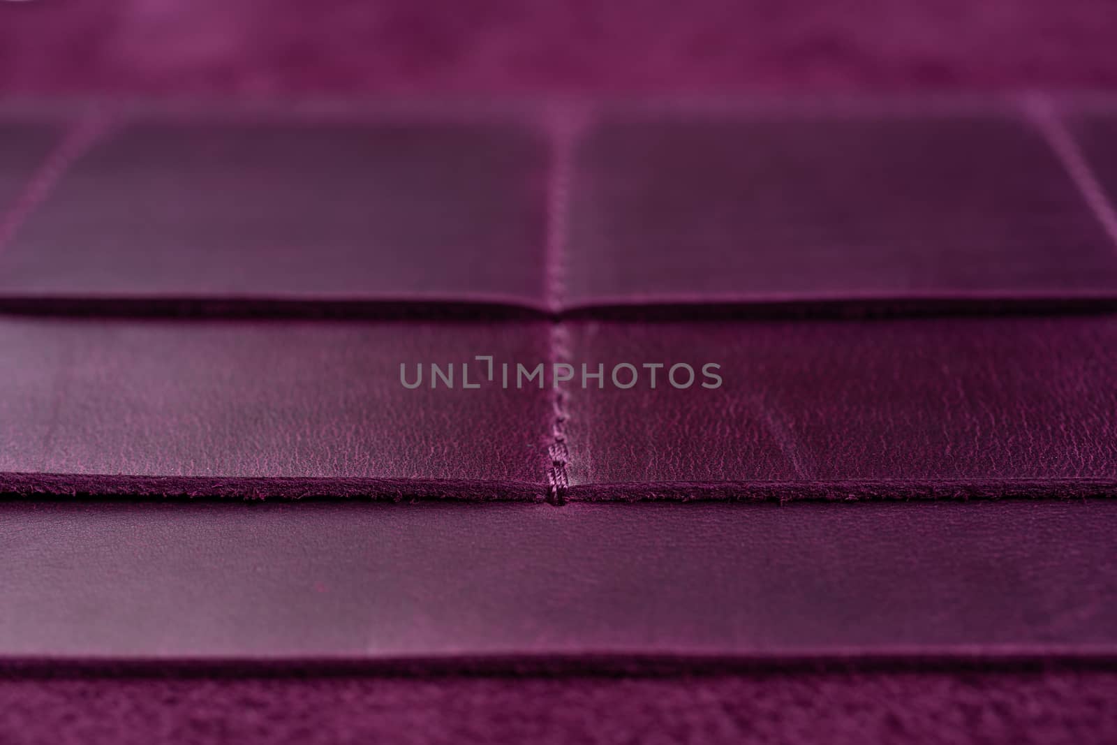 Purple handmade leather wallet details closeup. Pockets for cards, hue picture.