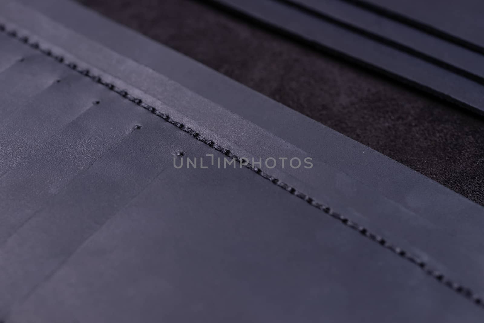 Dark blue handmade leather wallet details closeup. Pockets for c by alexsdriver