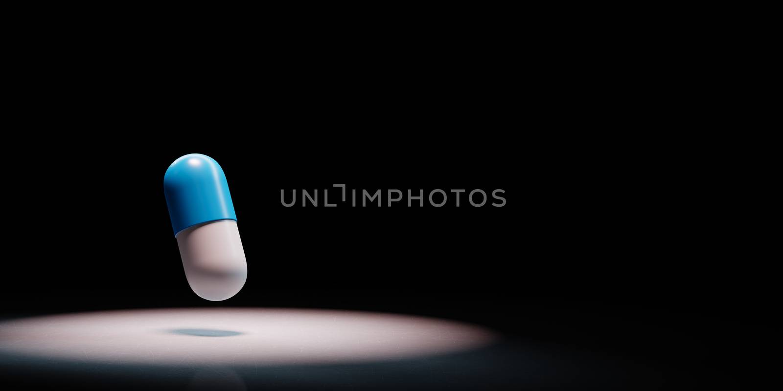 One Blue and White Pill Spotlighted on Black Background with Copy Space 3D Illustration