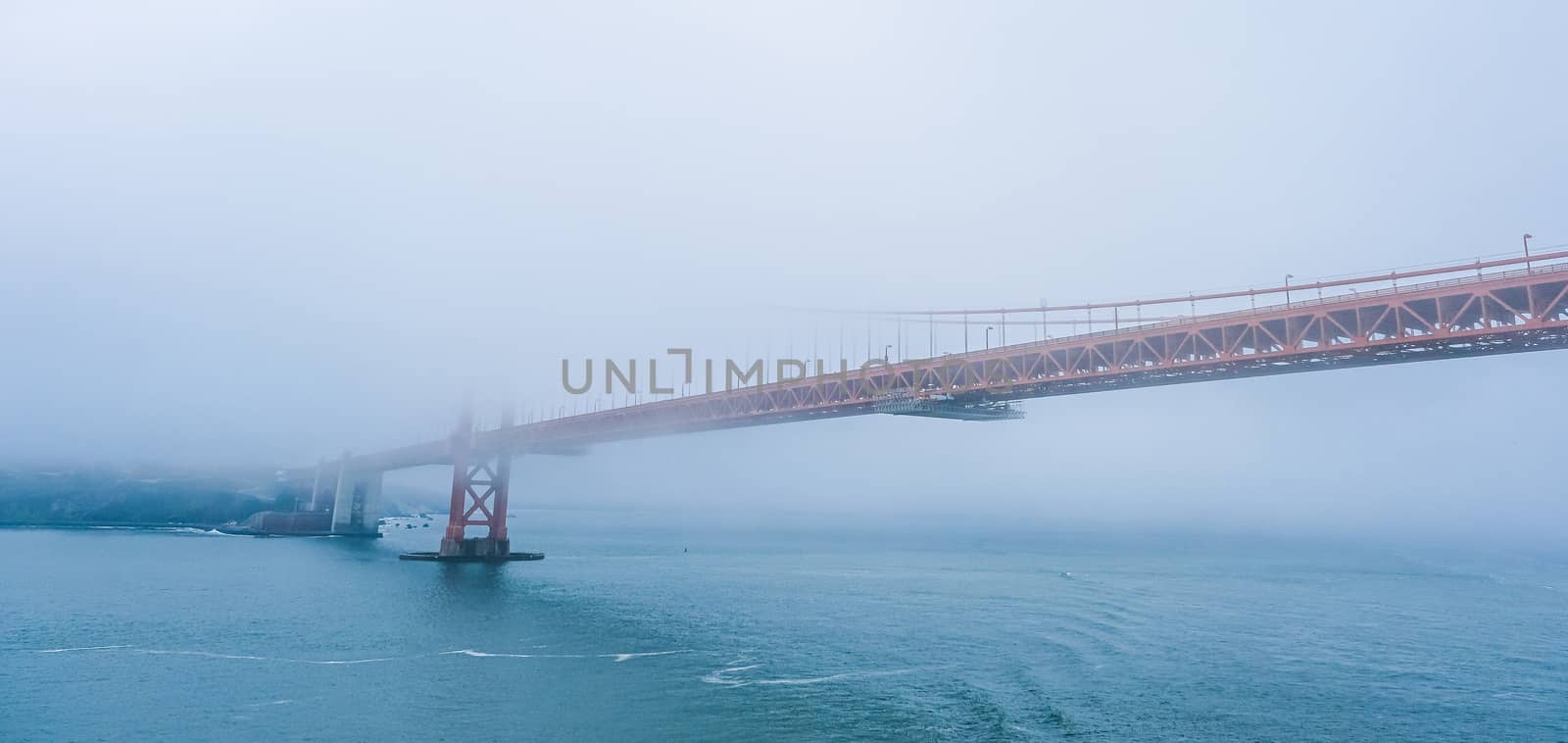 Golden Gate Bridge Across Foggy Bay by dbvirago