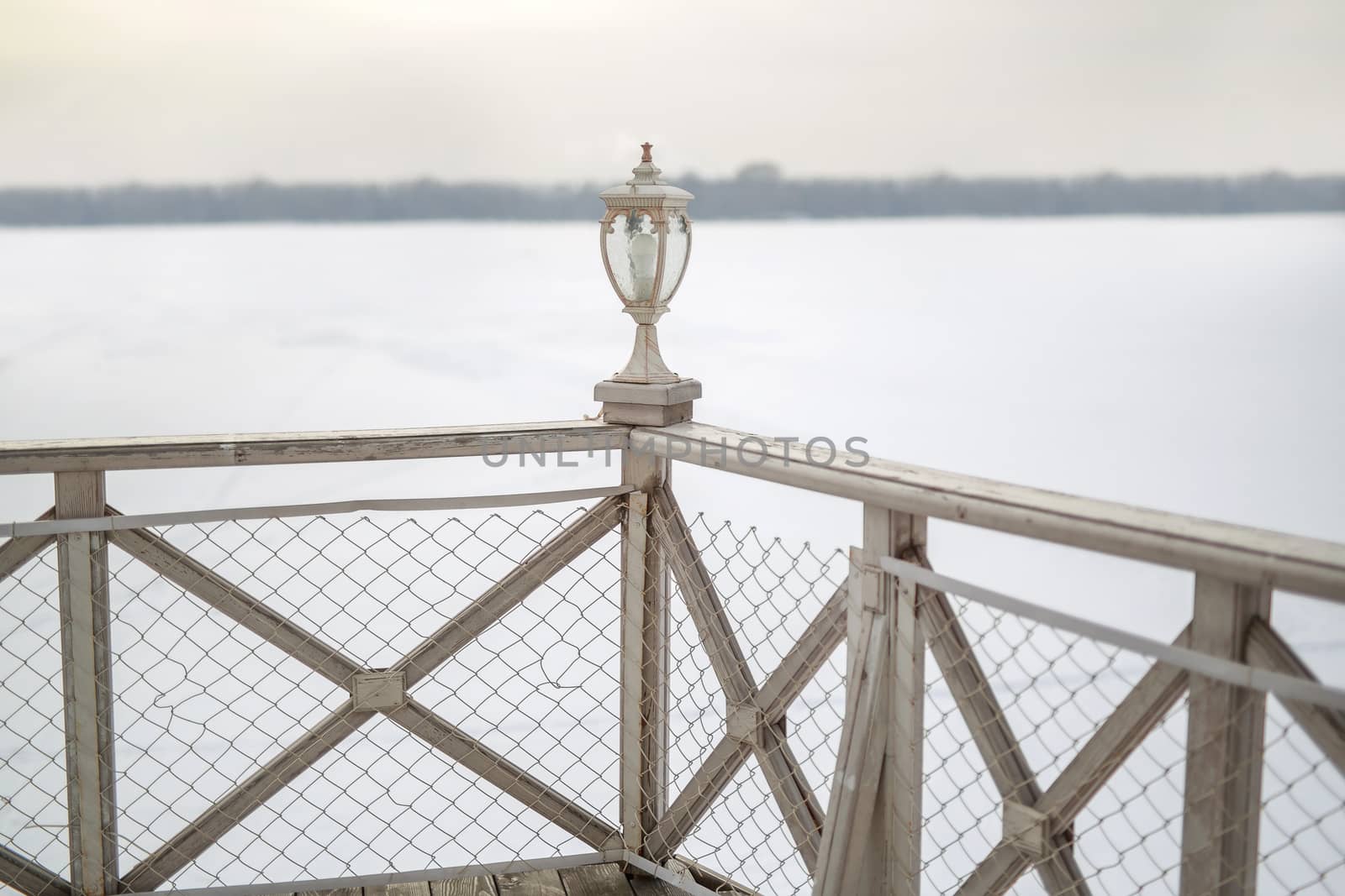 decorative white wooden lantern on Board ship, winter frosty white background by dikkens