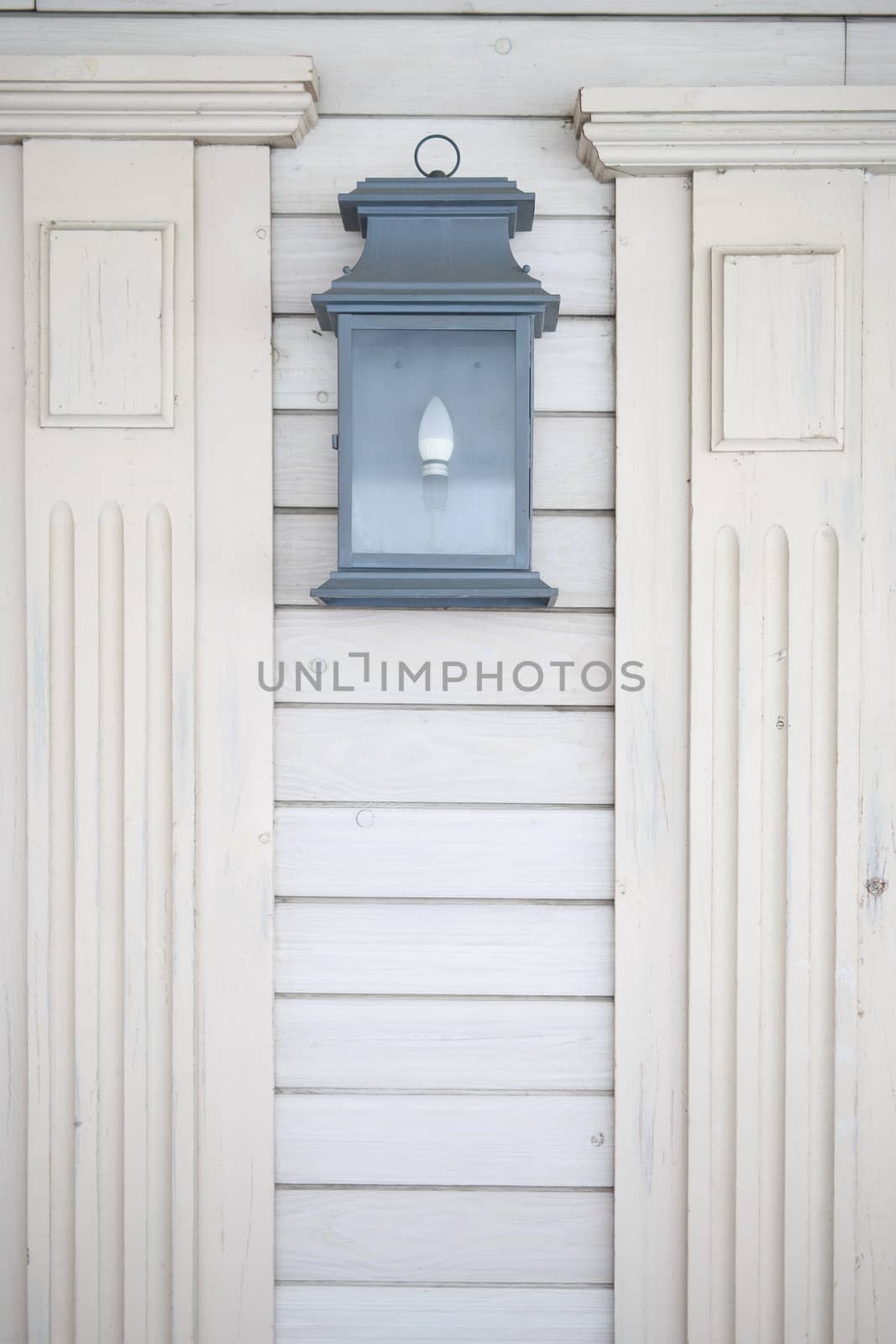 old lamp lantern iron black hanging on white painted old wall, home outdoor decoration by dikkens