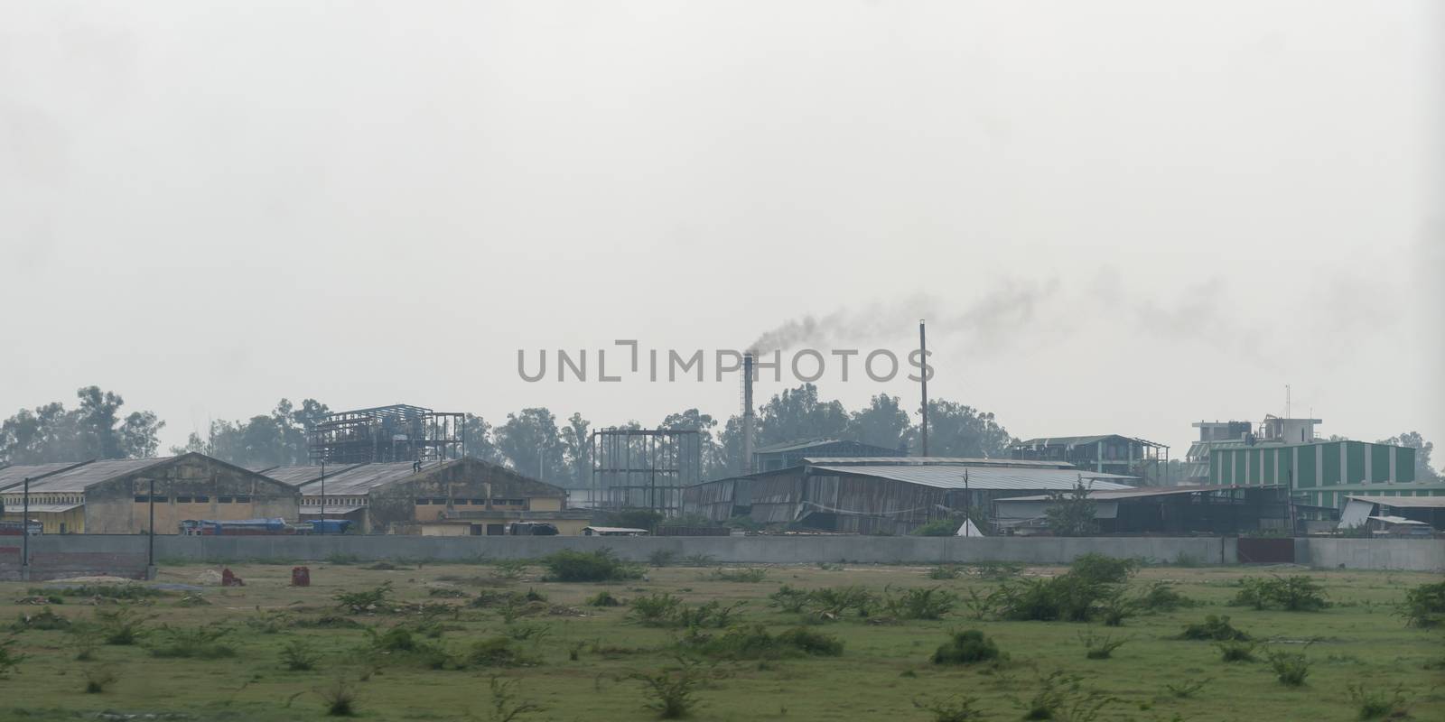 A Small and medium sector Village industries area surrounded by rural agricultural field and summer meadow. An industrial environment of Countryside West Bengal, India, south Asia pacific.