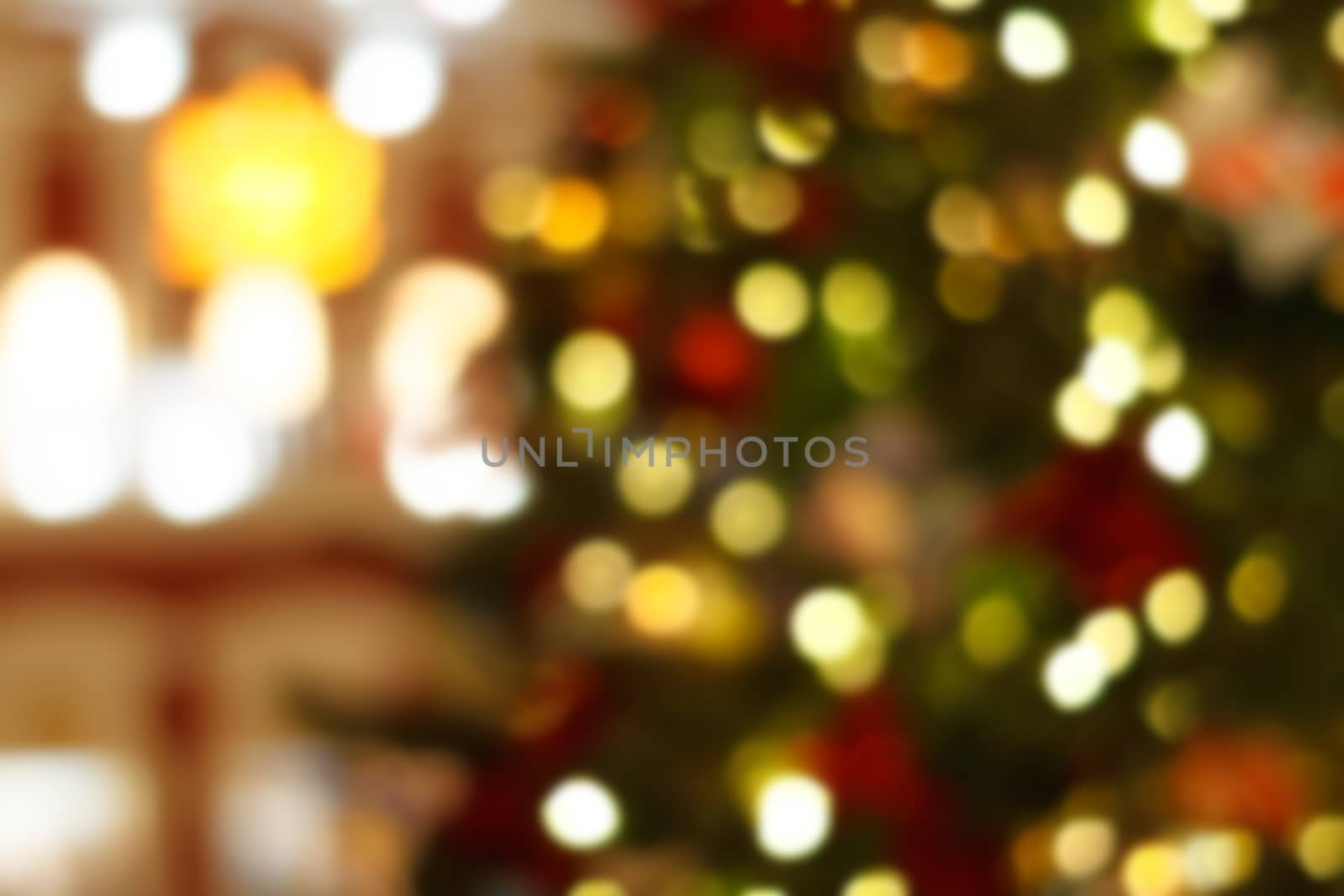 Colorful bokeh defocused Christmas garlands, Christmas fair. Festive abstract background.