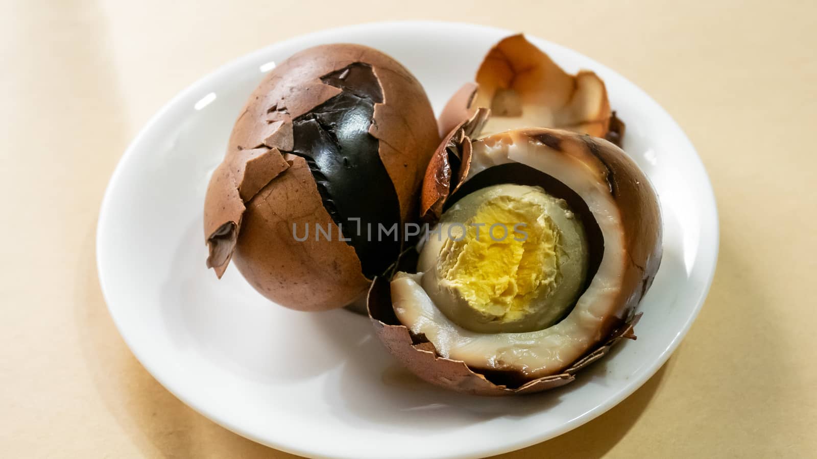 The close up of Taiwan Tea Eggs on mini white plate.