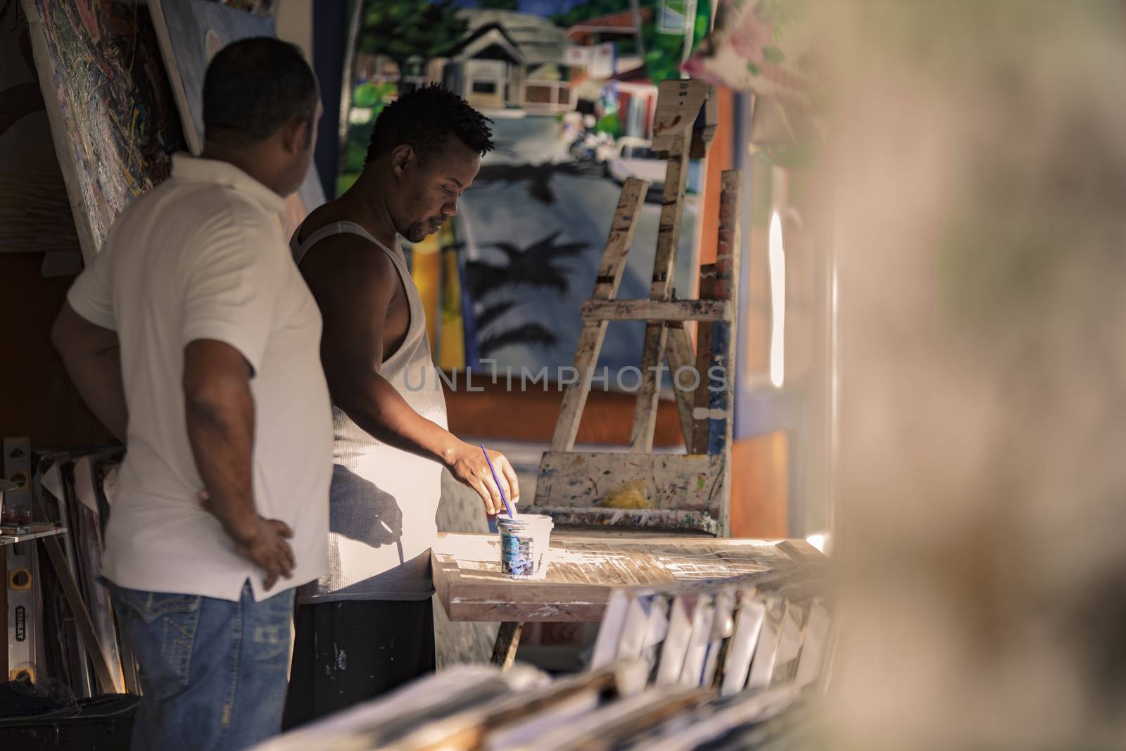 BAYAHIBE, DOMINICAN REPUBLIC 23 DECEMBER 2019: Dominican painter in Bayahibe