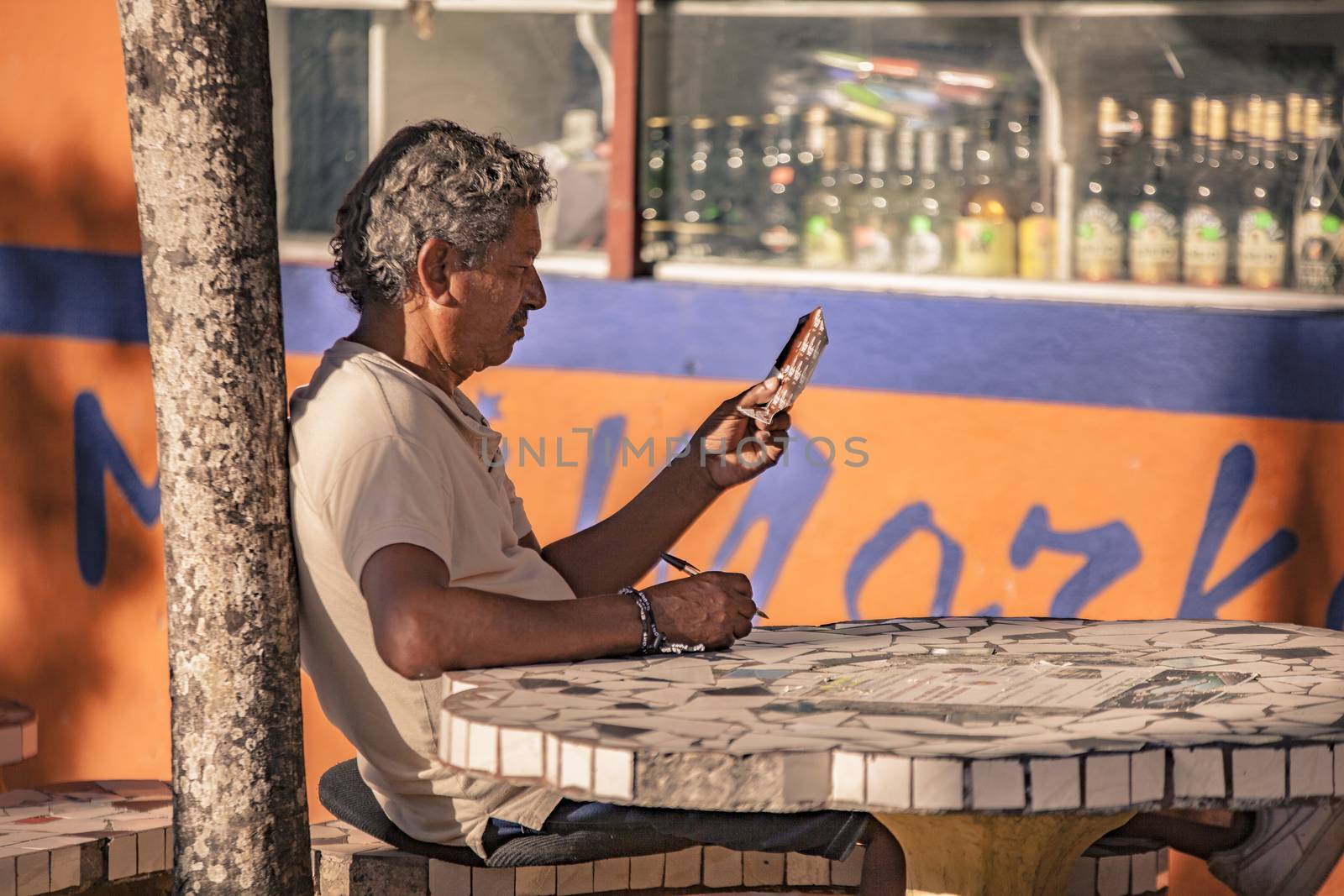 Dominican man sitted at bar by pippocarlot