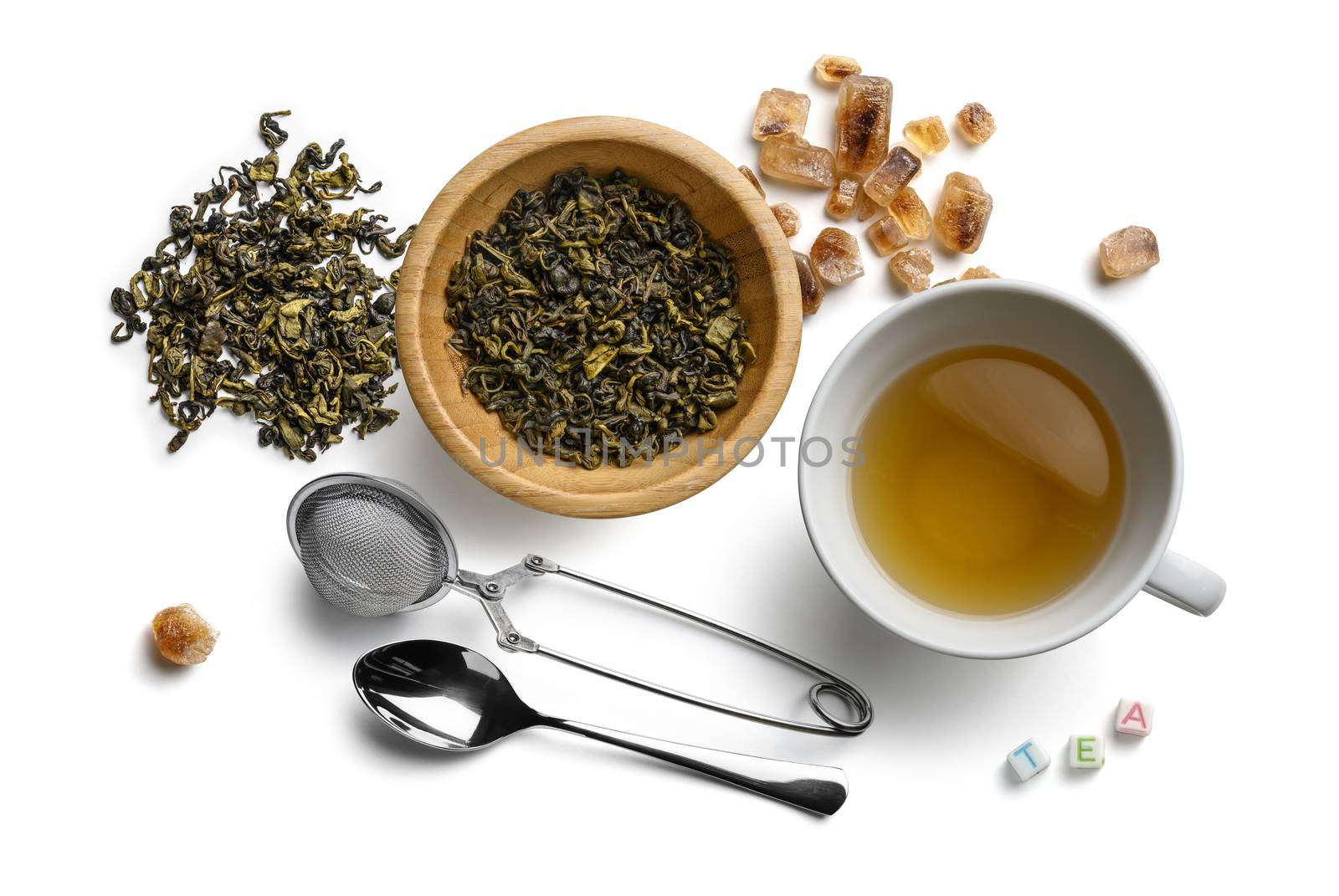 Green tea and accessories top view on white background.