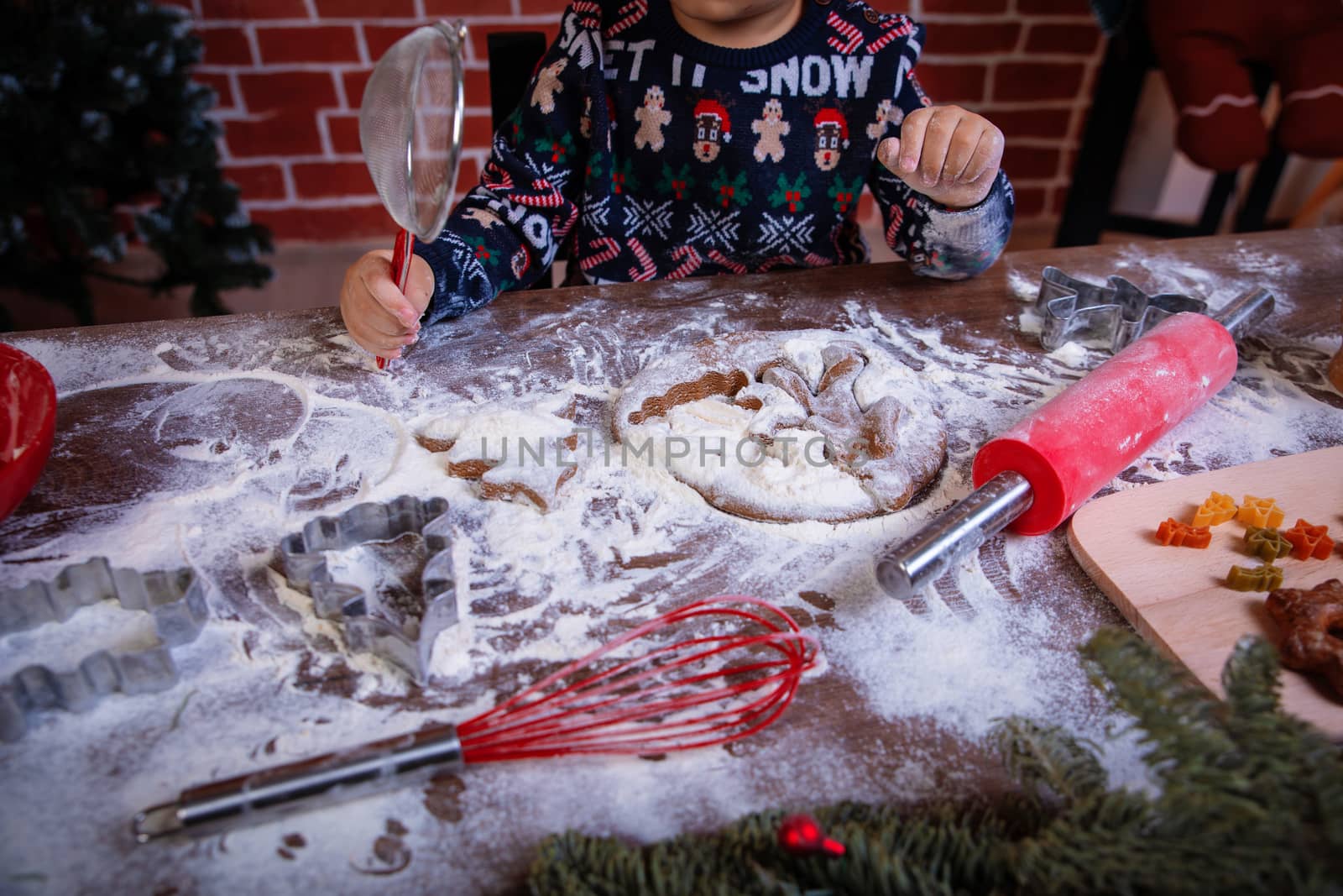 Dough and christmas cookie. Children making christmas cookies in the kitchen