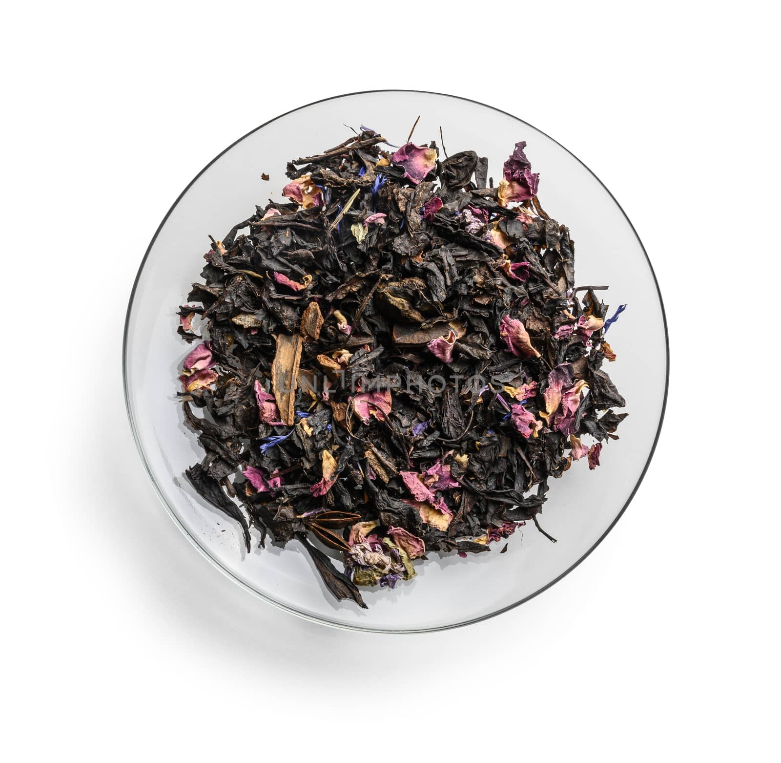 Black tea with natural aromatic additives. Top view on white background.