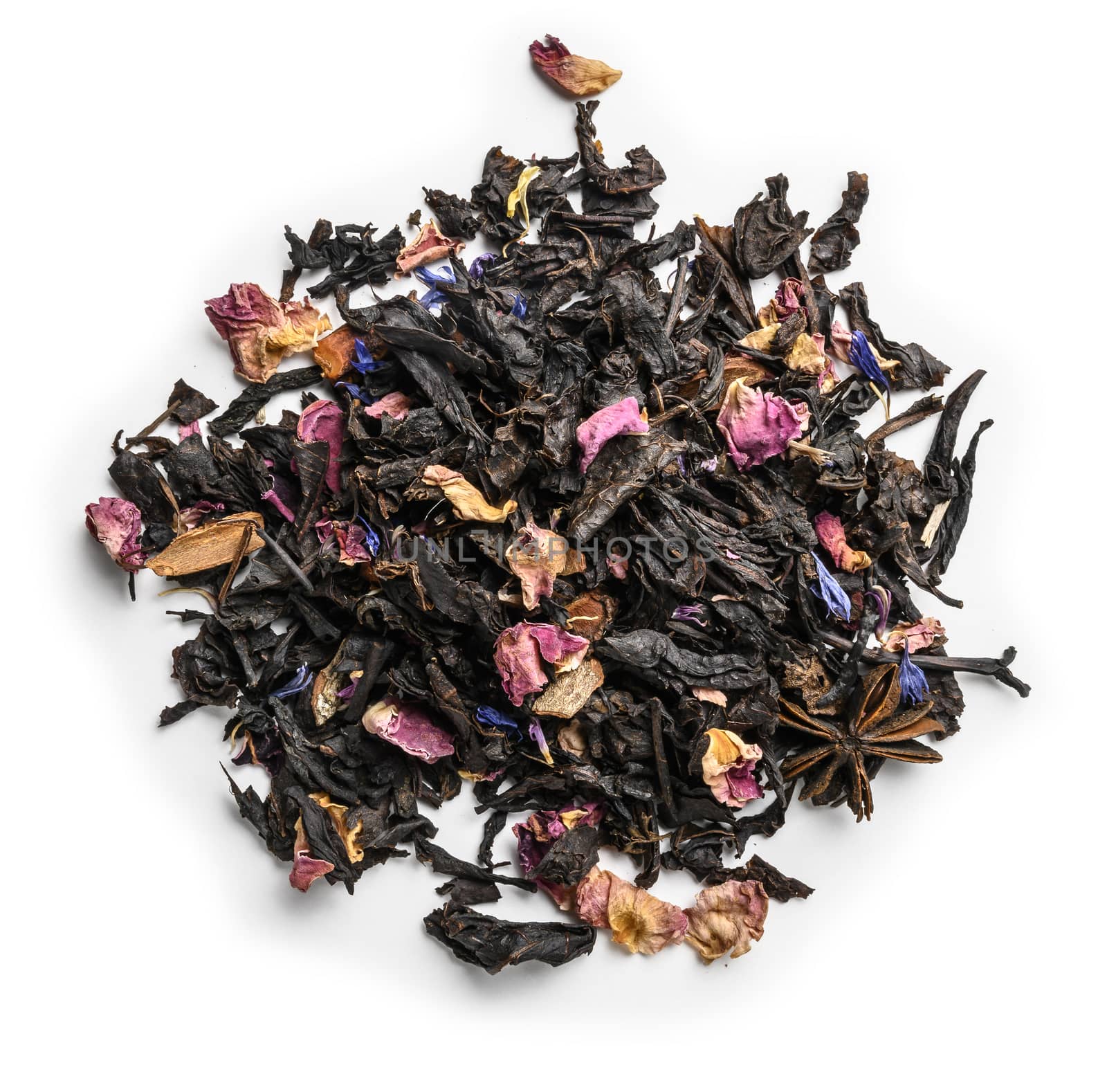 Black tea with natural aromatic additives. Top view on white background.