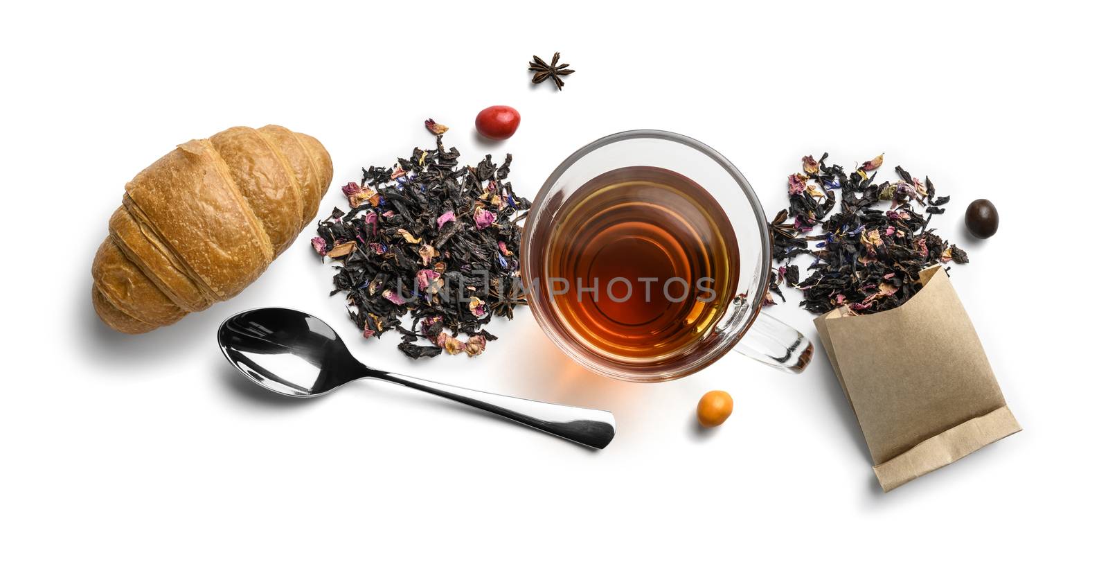 Black tea with natural aromatic additives and accessories. Top view on white background.
