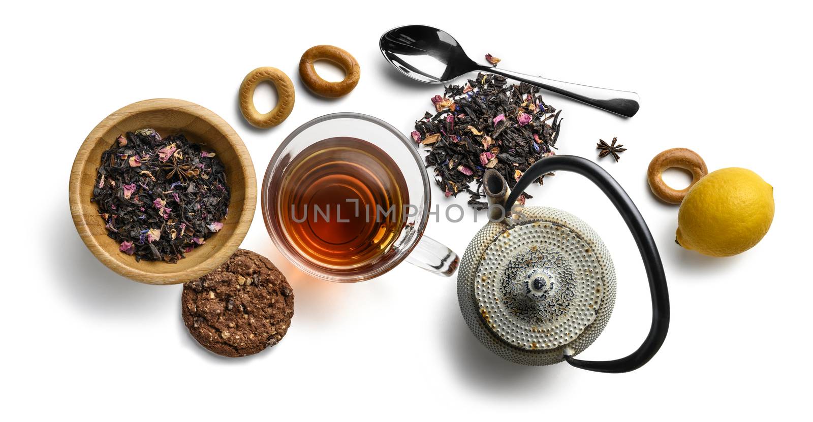 Black tea with natural aromatic additives and accessories. Top view on white background.