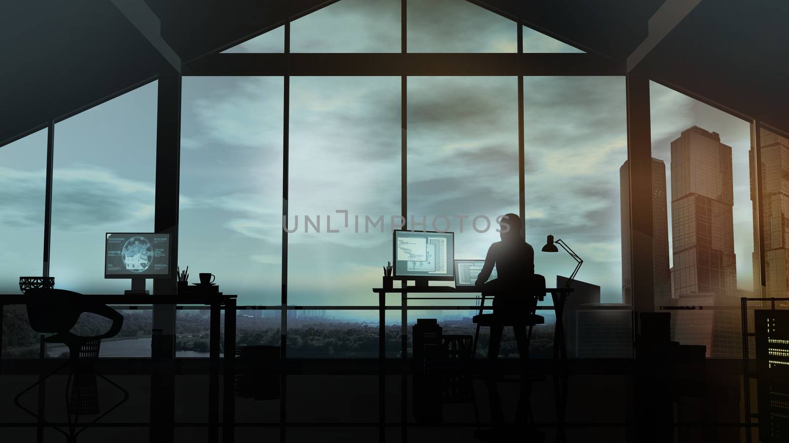 A woman works at a computer in her office against the background of a panoramic window.