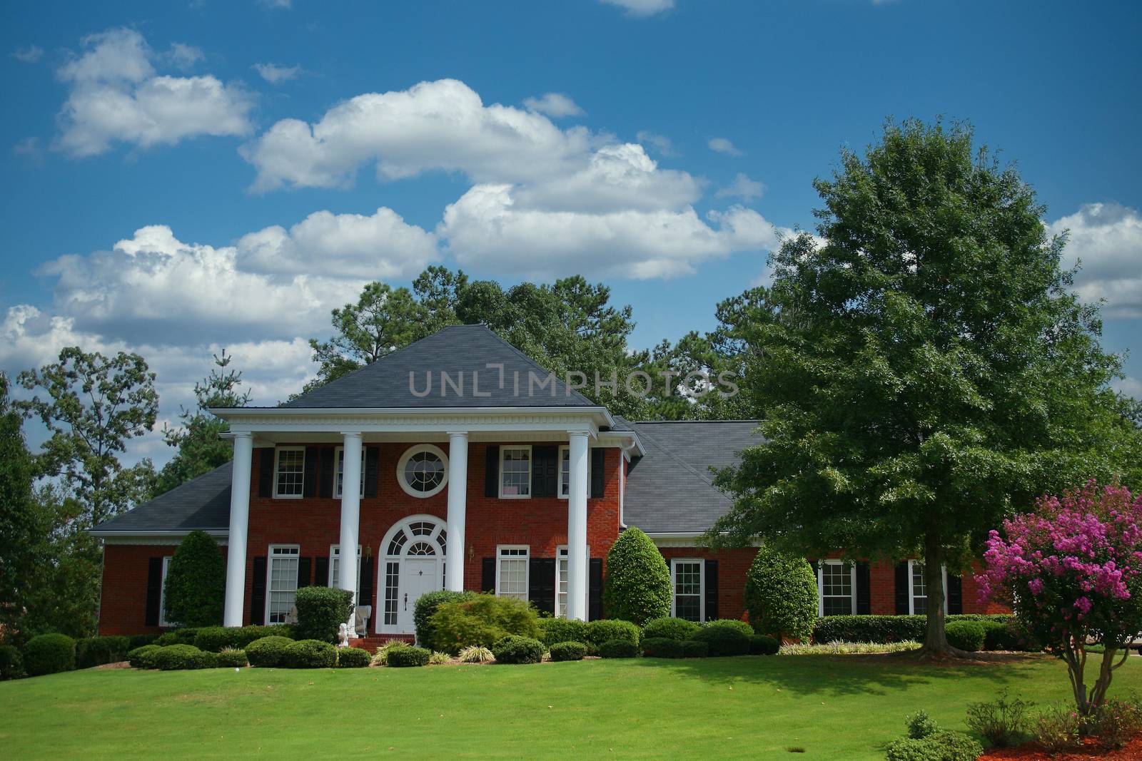 Columns on Nice Brick Home in Summer