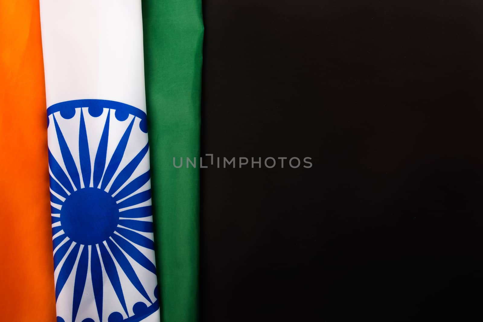 Indian republic day, flat lay top view, Indian flag on black background with copy space for your text