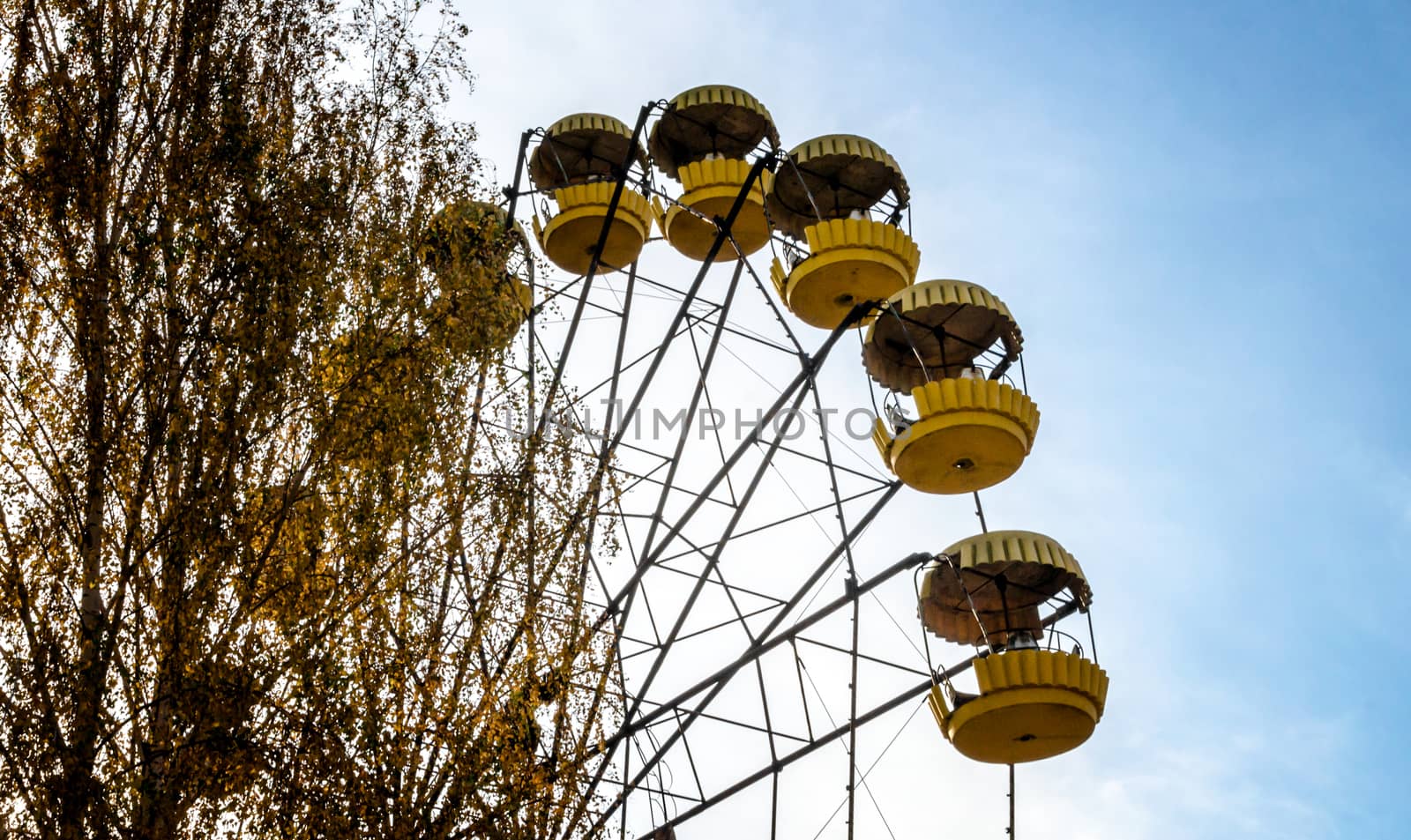 fragment old carousel wheel in an abandoned amusement park in Chernobyl Ukraine in autumn
