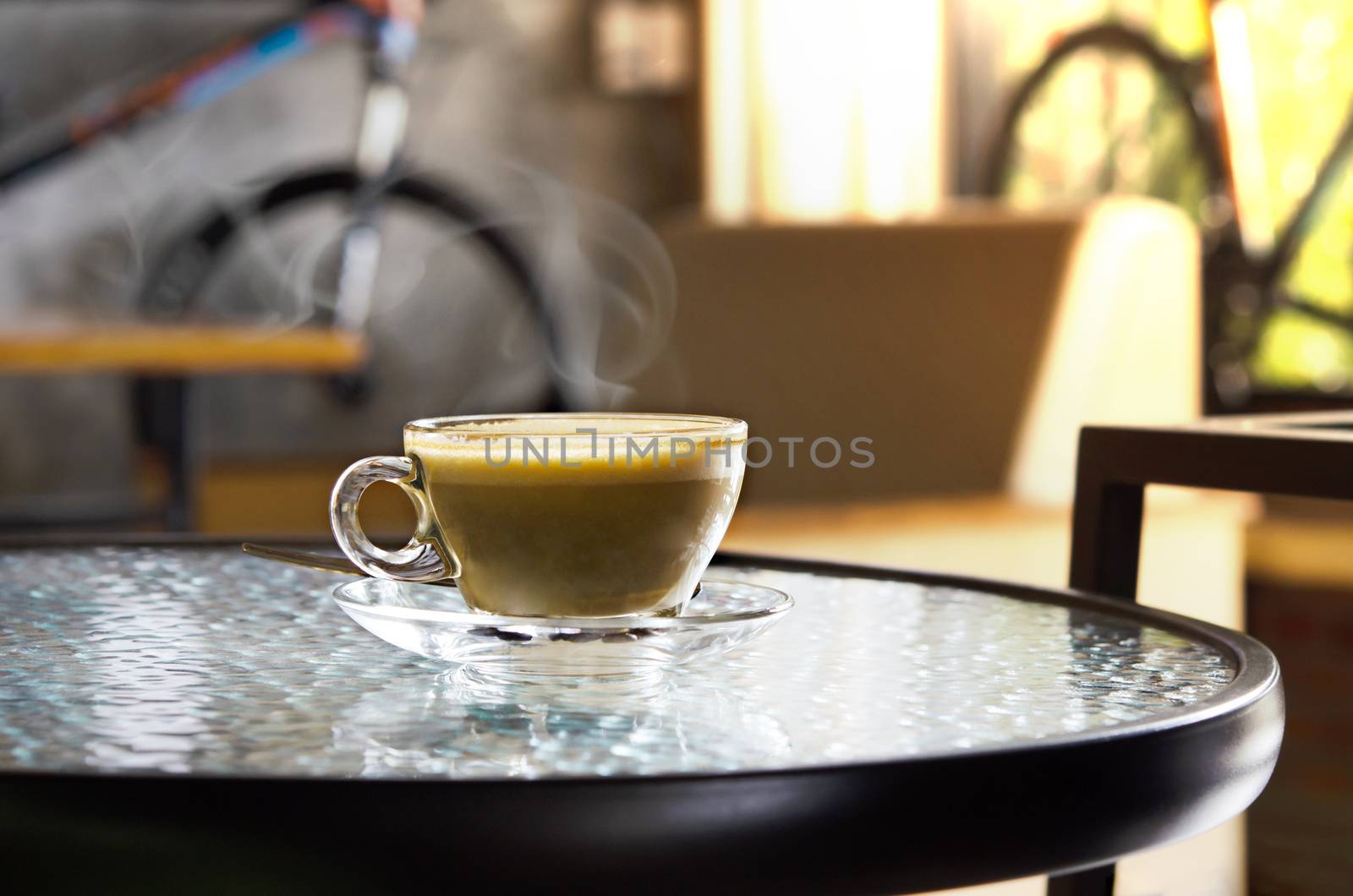 Cup of hot coffee latte on table in restaurant