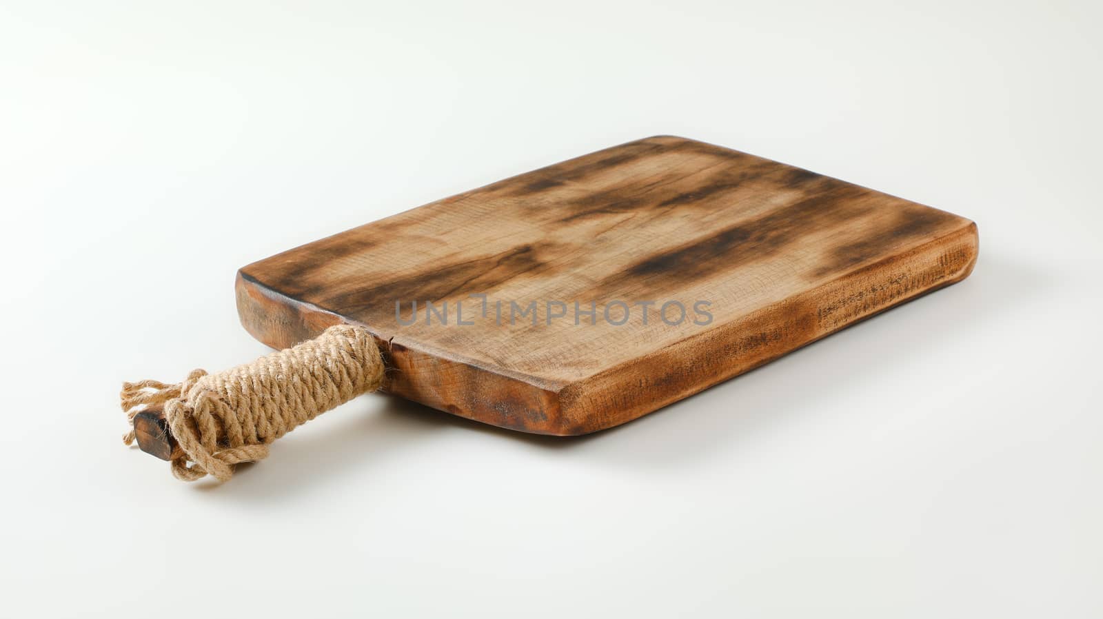 Rustic wooden cutting board or serving tray by Digifoodstock