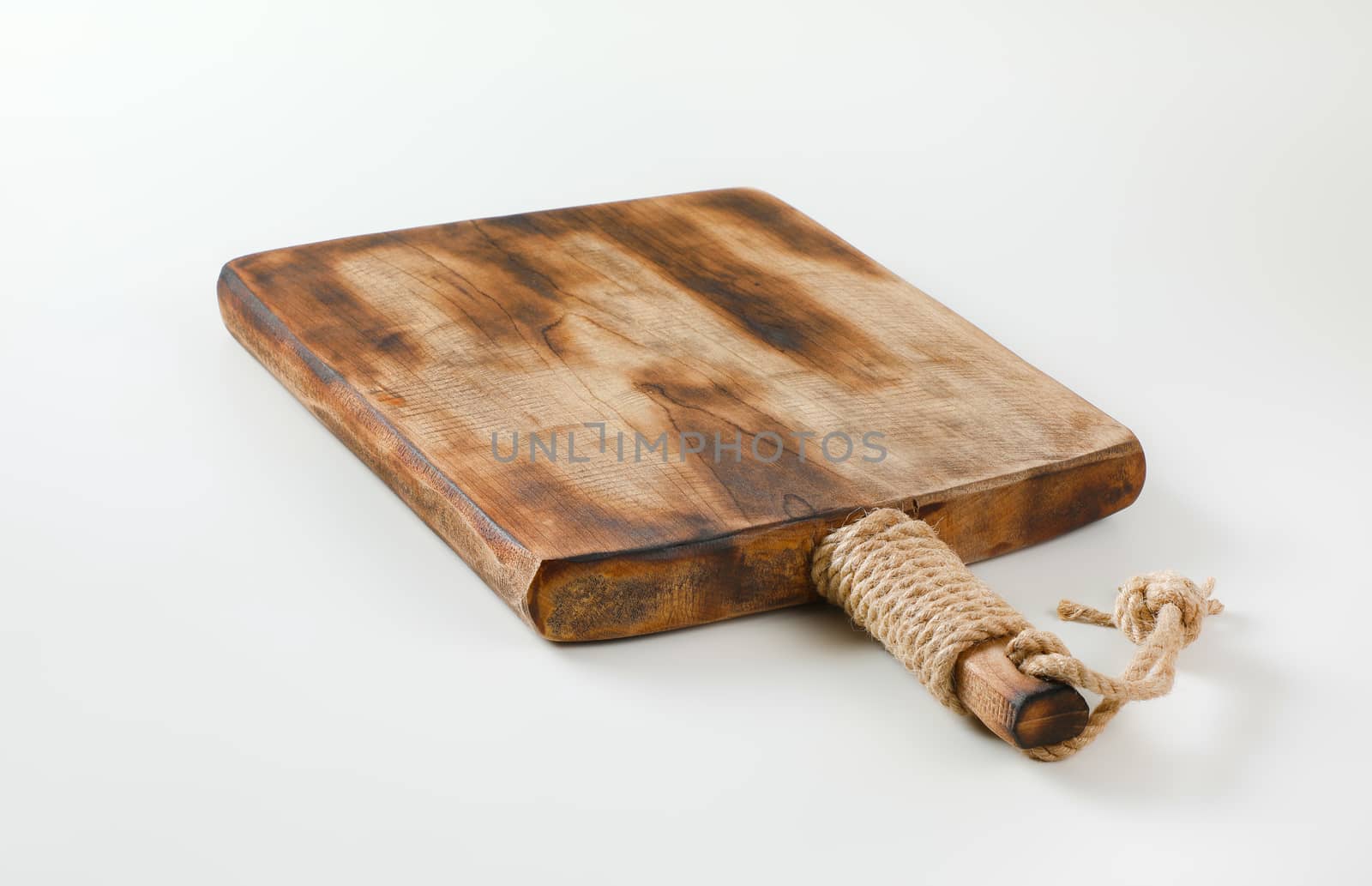 Rustic wooden cutting board or serving tray by Digifoodstock