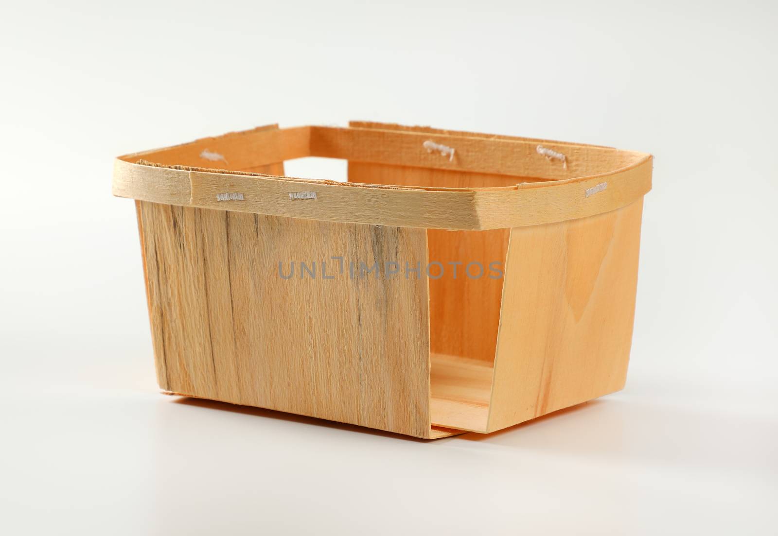 Empty wooden berry basket by Digifoodstock