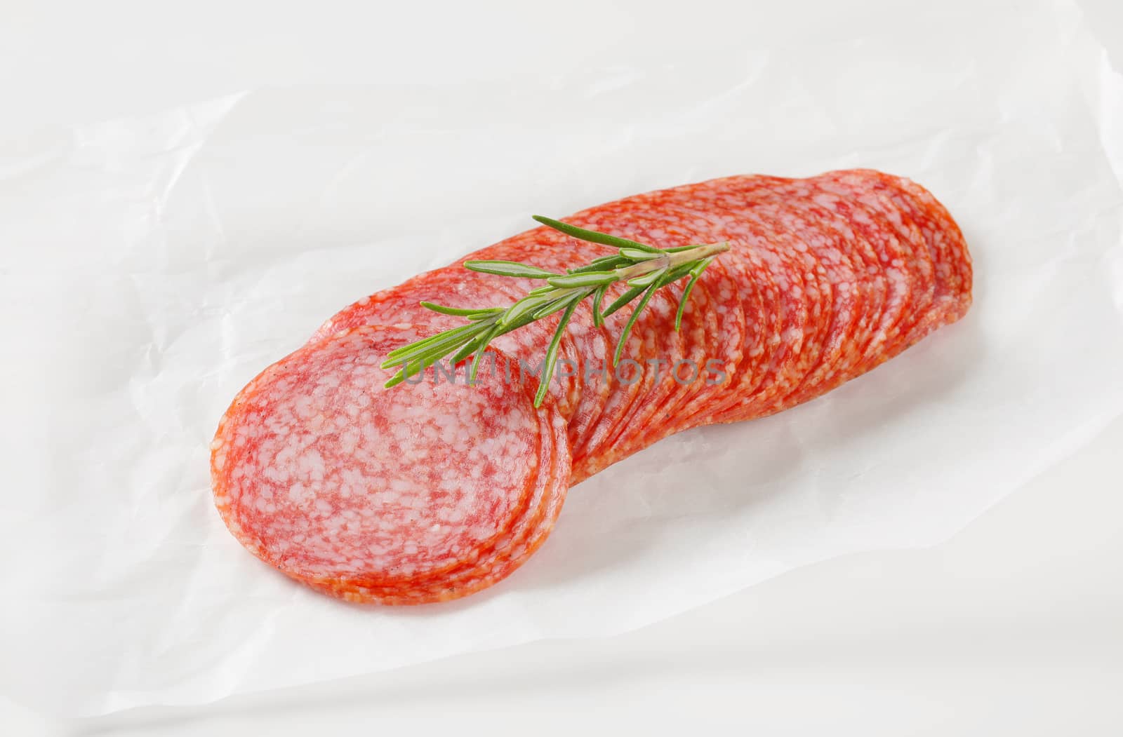 Sliced salami sausage by Digifoodstock