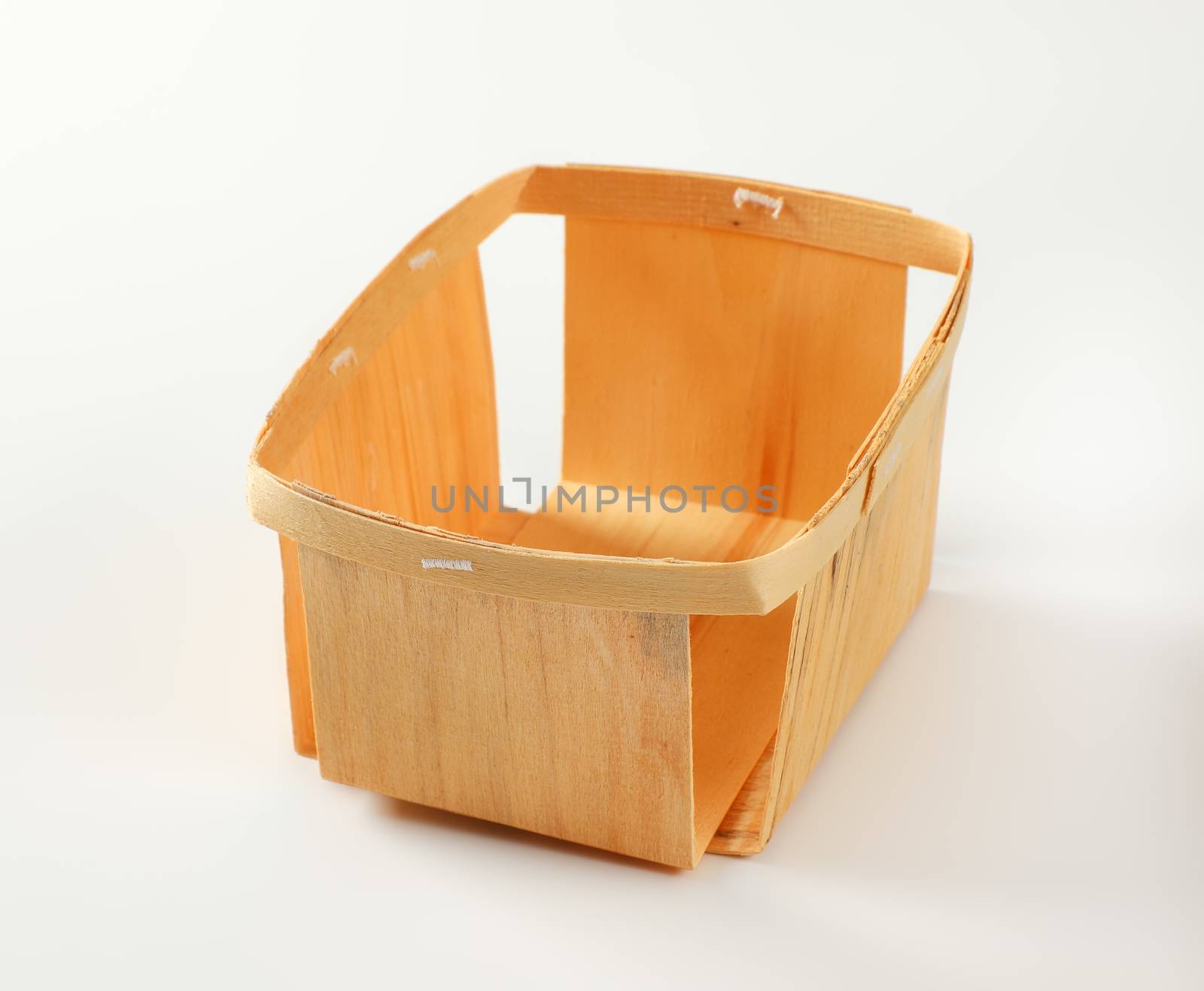 Empty rectangular wooden basket for berry fruits