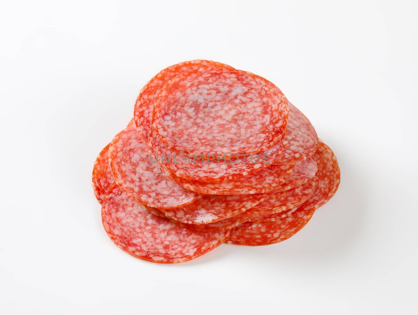 Thinly sliced salami sausage by Digifoodstock