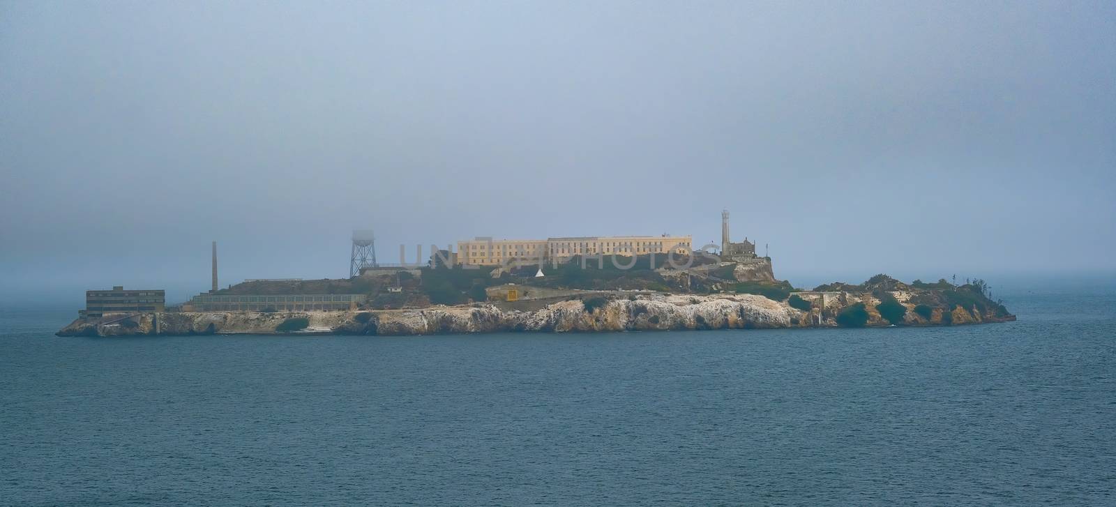 Prison of Alcatraz in rhe foggy bay