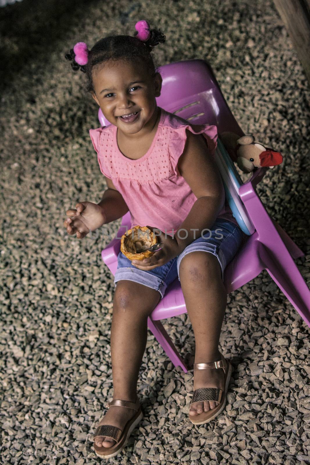 MONTANA REDONDA, DOMINICAN REPUBLIC 27 DECEMBER 2019: Dominican Child Sitted in a poor house